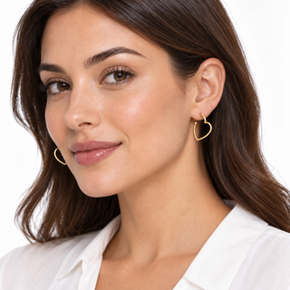 18K Solid Yellow Gold Polished Open Heart Thin Tube Post Earrings on a model