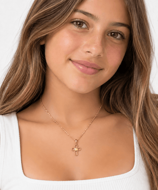 18K Solid Yellow Gold Small Polished Heart Open Cross in a 13 year old girl