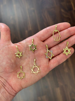 star of david pendants on a hand